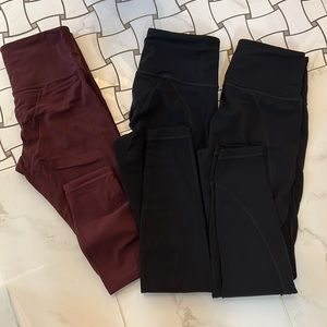 Lot of 3 pairs of Athleta leggings - 2 black and 1 maroon.